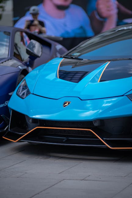 Luxury Cars - A vibrant blue Lamborghini Huracan captured in a #12499751