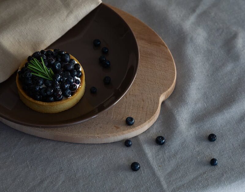 Food Aesthetics - Delicious blueberry tart on a ceramic plate with #12931396