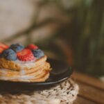 Food Aesthetics - Stack of pancakes topped with fresh strawberries #14716736