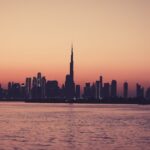 City Architecture - Scenic view of Dubai skyline at sunset featuring #15533154