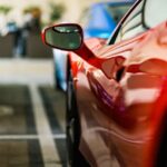 Luxury Cars - Close-up view of a red sports car's side mirror #17145736