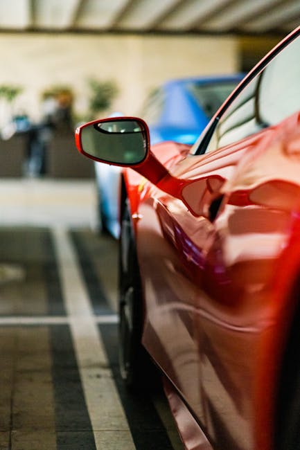 Luxury Cars - Close-up view of a red sports car's side mirror #17145736