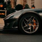 Luxury Cars - Close-up of a luxurious supercar wheel on a dark #18516678