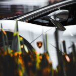 Luxury Cars - Stylish white sports car featuring a prominent l #20864107