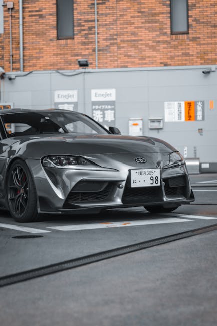 Luxury Cars - A modern gray Toyota Supra parked stylishly in a #23471333