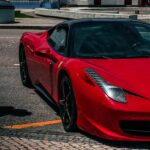 Luxury Cars - A vibrant red sports car parked on an urban stre #27530033