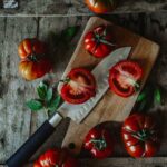 Food Aesthetics - Fresh heirloom tomatoes and knife on rustic wood #29081092