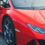 Luxury Cars - Close-up of a red sports car captured in a city #30022137