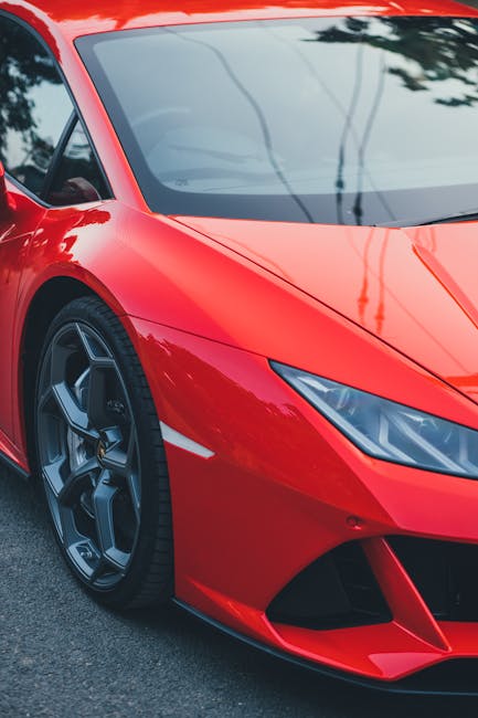 Luxury Cars - Close-up of a red sports car captured in a city #30022137