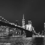 City Architecture - Black and white view of Brooklyn Bridge with Man #30532248