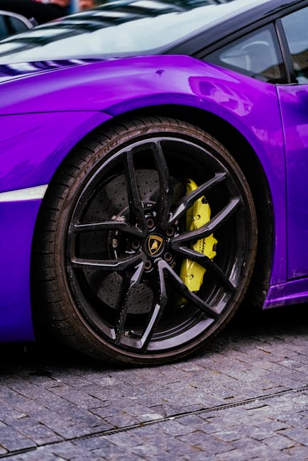 Luxury Cars - Detailed view of purple luxury sports car wheel #32364025
