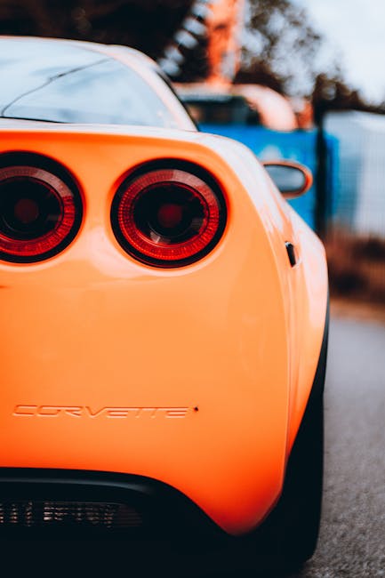 Luxury Cars - A vibrant orange sports car showcasing its sleek #33285084