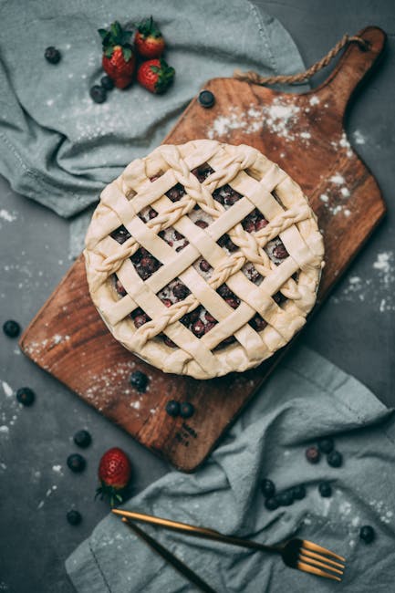 Food Aesthetics - Delicious lattice-top pie with blueberries on a #5107179