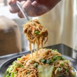Food Aesthetics - Delicious stir-fried noodles topped with fresh v #5348719