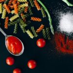 Food Aesthetics - Vibrant flatlay of uncooked fusilli, asparagus, #5794882