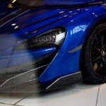 Luxury Cars - Detailed close-up of a sleek blue supercar displ #6152814