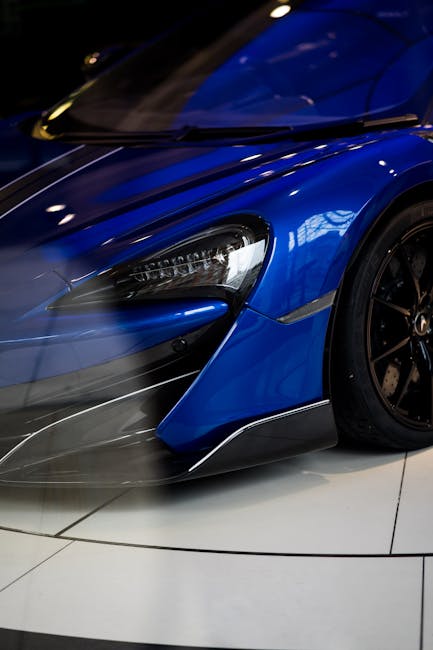 Luxury Cars - Detailed close-up of a sleek blue supercar displ #6152814