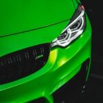 Luxury Cars - Close-up of a vibrant green sports car with focu #6597509