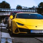 Luxury Cars - A vibrant yellow Lamborghini hypercar parked out #6957588