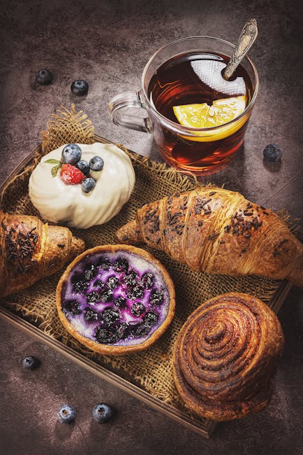 Food Aesthetics - A selection of pastries with blueberries, cream, #7332909