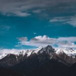 Mountain Landscapes - Picturesque view of high mountain peaks covered #7844512